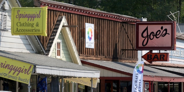 Joe's Bar and other businesses are seen along Highway 9 in downtown Boulder Creek, Calif., on Thursday, Oct. 8, 2020. 