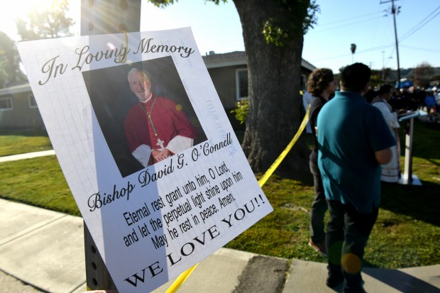 Father Albert Avenido, of Sacred Heart Catholic Church in Covina, leads a street mass in memory of LA Archdiocese Bishop Rev. David O'Connell, who was killed yesterday nearby, in Hacienda Heights on Sunday, February 19, 2023. (Photo by Axel Koester, Contributing Photographer)