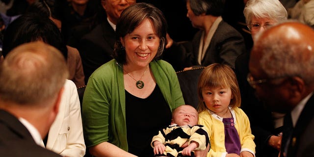 Ann O'Leary, wife of University of California at Berkley Law Professor Goodwin Liu, holds their 1-month old son Emmett and sits with their daughter, Violet, 3, before Liu's confirmation hearing to be U.S. Circuit Judge for the Ninth Circuit before the Senate Judiciary Committee April 16, 2010 in Washington, DC.