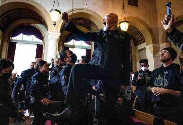 Baba Akili, of Black Lives Matter, attempts to shut down the Los Angeles City Council meeting where protesters continue to seek Councilman Kevin de León's resignation on Tuesday, December 13, 2022 before being escorted out by LAPD. The council including de León voted in support of the resolution on Mayor Karen Bass' state of emergency on homelessness. (Photo by Sarah Reingewirtz, Los Angeles Daily News/SCNG)