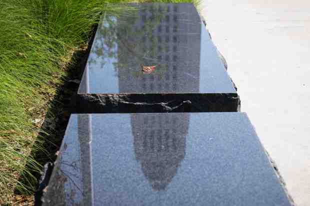 Los Angeles City Hall is reflected in a Grand Park bench on Monday, October 10, 2022. On Monday Nury Martinez resigned her city council presidency after being recorded making racist comments. (Photo by Sarah Reingewirtz, Los Angeles Daily News/SCNG)