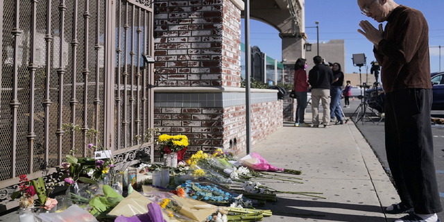 Kenny Loo, 71, prays outside Star Ballroom Dance Studio for the victims killed in Saturday's shooting in Monterey Park, California, on Monday, Jan. 23.