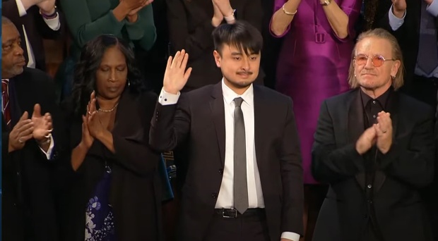 Brandon Tsay, 26, stands as President Joe Biden acknowledges him at his 2023 State of the Union speech on Feb. 7, 2023. (Courtesy)