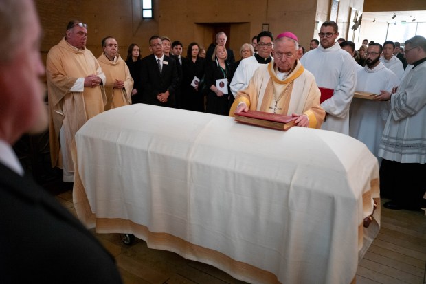 Archbishop Jose Gomez places a bible on the casket of Bishop David O'Connell at Funeral Mass held at the Cathedral of Our Lady of the Angels in Los Angeles, CA Friday, March 3, 2023. O'Connell was found shot at his Hacienda Heights home on February 18. The suspect in the shooting, 61-year-old Carlos Medina, has been charged with the murder. (Photo by David Crane, Los Angeles Daily News/SCNG)