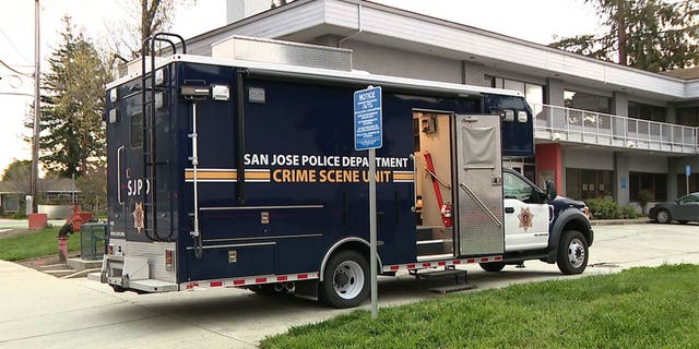 San Jose Police Department Crime Scene Unit truck parked outside where a man wielding a machete held three hostages in San Jose, California.