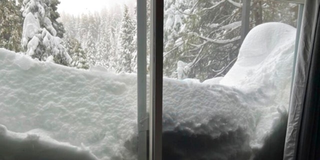 Snow blocks a slider door of Jennifer Cobb's house in Lake Arrowhead on Tuesday, Feb. 28, 2023, in the San Bernardino Mountains of San Bernardino County, California.