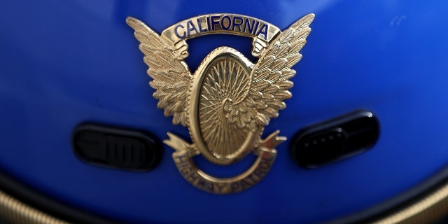 closeup of California Highway Patrol badge on helmet