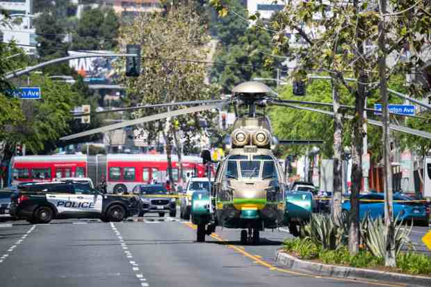 Sheriff's helicopter sits on La Brea Avenue after dropping off a SWAT-like team and medics after a shooting at The Dylan apartments on Friday, April 7, 2023 in West Hollywood. (Photo by Sarah Reingewirtz, Los Angeles Daily News/SCNG)