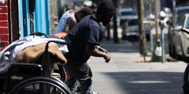 Homeless people in the Tenderloin district of San Francisco Sept. 24, 2022. 