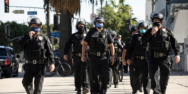 Los Angeles Police Department officers march in formation on Jan. 20, 2021.