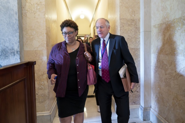 Shalanda Young, director of the Office of Management and Budget, left, and Steve Ricchetti, counselor to the president, the top negotiators for President Joe Biden on the debt limit crisis, head for the exit after talks with House Speaker Kevin McCarthy's emissaries came to an abrupt halt, at the Capitol in Washington, Friday, May 19, 2023. (AP Photo/J. Scott Applewhite)