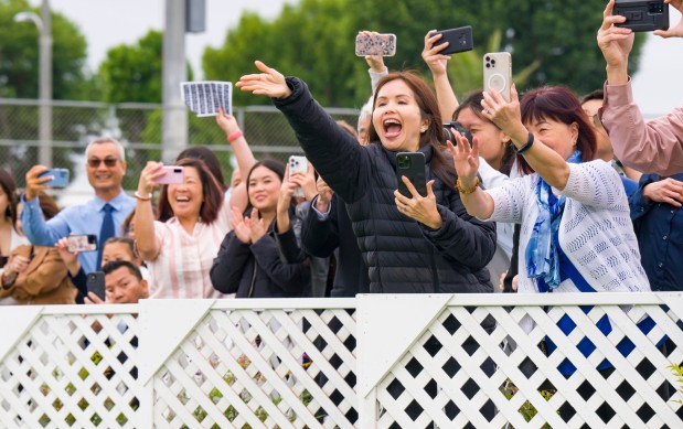 Parents yell out to their graduating senior during the Oxford Academy graduation ceremonies in Handel Stadium at Western High School in Anaheim on Tuesday, May 23, 2023. (Photo by Leonard Ortiz, Orange County Register/SCNG)