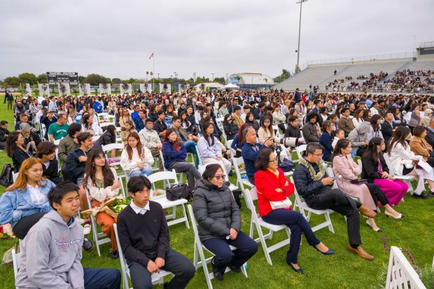 Most parents chose to sit on the field instead of the stands during the Oxford Academy graduation ceremonies in Handel Stadium at Western High School in Anaheim on Tuesday, May 23, 2023. (Photo by Leonard Ortiz, Orange County Register/SCNG)