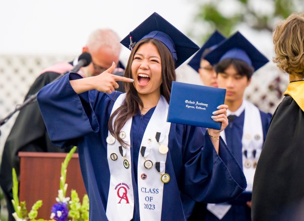 A graduate celebrates after receiving her diploma during the Oxford Academy graduation ceremonies in Handel Stadium at Western High School in Anaheim on Tuesday, May 23, 2023. (Photo by Leonard Ortiz, Orange County Register/SCNG)