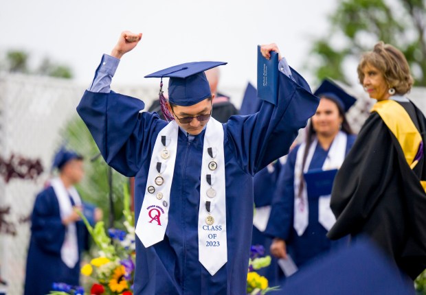 A graduate celebrates after receiving his diploma during the Oxford Academy graduation ceremonies in Handel Stadium at Western High School in Anaheim on Tuesday, May 23, 2023. (Photo by Leonard Ortiz, Orange County Register/SCNG)