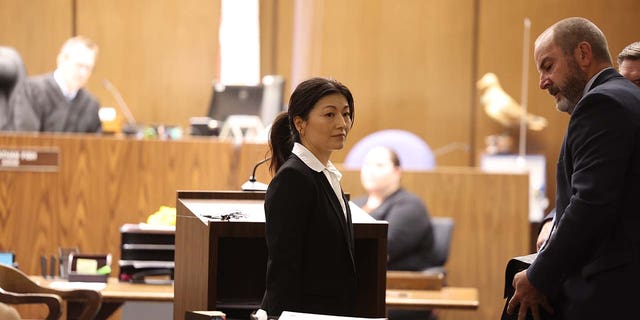 Yue Yu exits the courtroom in the Superior Court of California of the County of Orange Tuesday