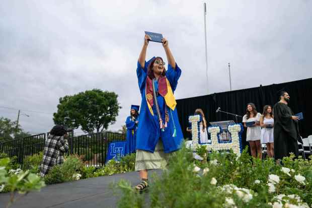 Senior Mia Flores shows off a diploma to family and friends during the La Habra High School graduation ceremony on Wednesday, May 31st, 2023. (Photo by Michael Ares, Contributing Photographer)