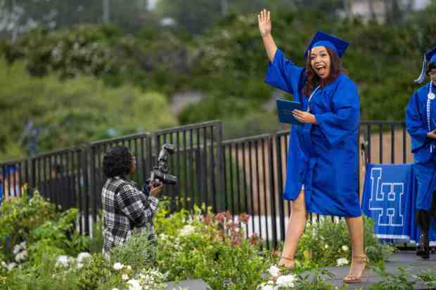 Senior Dulce Lopez waves to family and friends after receiving a diploma during the La Habra High School graduation ceremony on Wednesday, May 31st, 2023. (Photo by Michael Ares, Contributing Photographer)