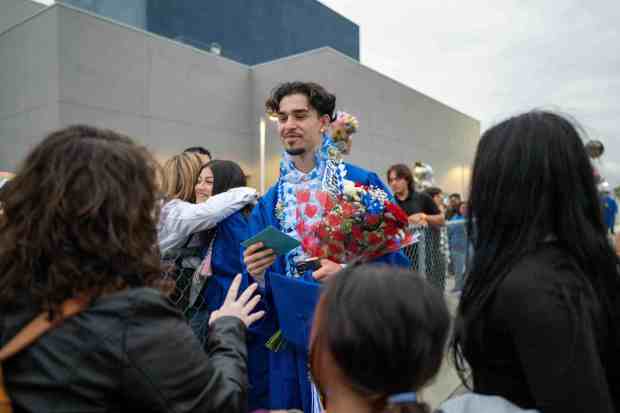 Senior student Jacob Gradilla receives gifts from family and friends after the graduation ceremony at the La Habra High School on Wednesday, May 31st, 2023. (Photo by Michael Ares, Contributing Photographer)