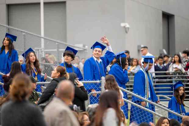 Senior students walk toward the La Habra High School graduation ceremony on Wednesday, May 31st, 2023. (Photo by Michael Ares, Contributing Photographer)