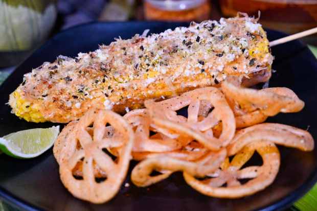 San Fransokyo-style Street Corn; with Togarashi mayonnaise, queso fresco, furikake, and bonito flakes served with wheat chicharrones available starting July 26 at Cocina Cucamonga Mexican Grill in San Fransokyo Square in Anaheim, CA, on Friday, July 14, 2023. San Fransokyo Square is taking over the former Pacific Wharf area of Disney California Adventure. It's slated to be complete in August 31, 2023. (Photo by Jeff Gritchen, Orange County Register/SCNG)