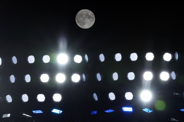 A super blue moon is seen above the stadium lights during the game between the Dodgers and the Arizona Diamondbacks on Wednesday night at Dodger Stadium. (Photo by Kevork Djansezian/Getty Images)