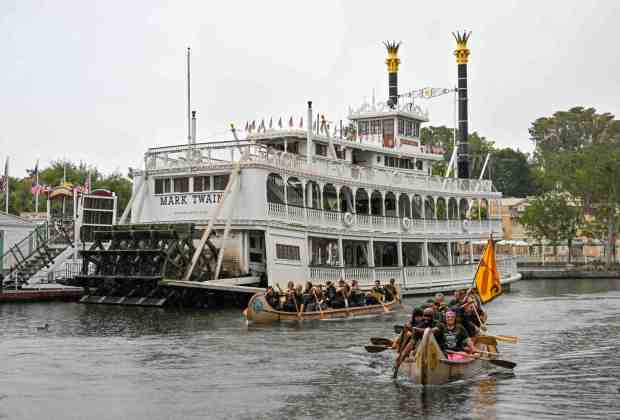 Teams take a victory lap after winning their divisions during the Disneyland Resort Canoe Races in the Rivers of America inside Disneyland in Anaheim, CA, on Thursday, August 10, 2023. They won the Fastest on the River award. (Photo by Jeff Gritchen, Orange County Register/SCNG)