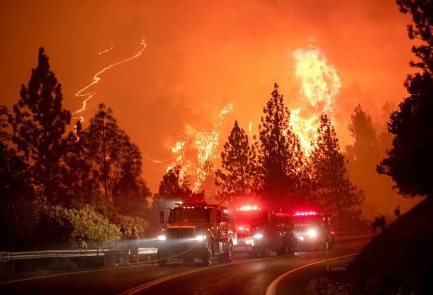 Firefighters stage along Highway 162 as the Bear Fire heats up again, Wednesday, Sept. 9, 2020, at Lake Oroville in Northern California. (Karl Mondon/Bay Area News Group)