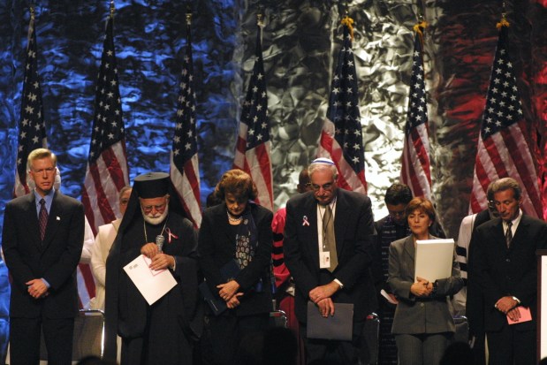 Bay Area political and religious leaders gathered Monday, September 17, 2001 for a "San Francisco Day of Remembrance," Monday morning at the Bill Graham Civic Auditorium in San Francisco. From left are Governor Gray Davis, left, His Eminence, Metropolitan Anthony of the Greek Orthodox Church, Senator Dianne Feinstein, Secretary George Schultz, Senator Barbara Boxer, Rabbi Martin Weiner, Congregation Sherith Israel, and Tom Ammiano, President of the Board of Supervisors. (Susanna Frohman/Staff Archives)