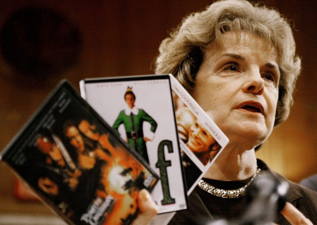 U.S. Senator Dianne Feinstein (D-CA) holds up pirated DVDs during a news conference announcing legislation to combat copyright piracy in Washington D.C. on November 13, 2003. (Mark Wilson/Getty Images)