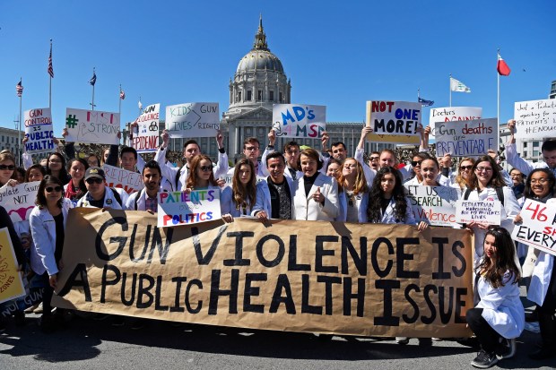 U.S. Senator Dianne Feinstein joins UCSF medical students as they gather at Civic Center during a March For Our Lives rally in San Francisco, Calif., on Saturday, March 24, 2018. (Jose Carlos Fajardo/Staff Archives)