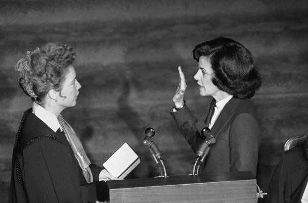 FILE - Chief Justice Rose Bird, left, administers the oath of office as Dianne Feinstein is sworn in as mayor of San Francisco during ceremonies in the City Hall, San Francisco, Jan. 8, 1980. Democratic Sen. Dianne Feinstein of California has died. She was 90. (AP Photo/Sal Veder, File)