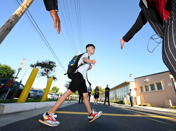 LBUSD Superintendent Jill A. Baker greets students entering Garfield Elementary School for their first day of the Fall semester in Long Beach on Wednesday, August 30, 2023. (Photo by Brittany Murray, Press-Telegram/SCNG)