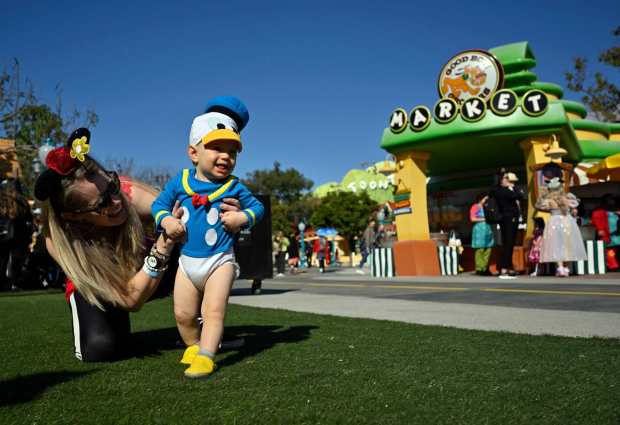 Kristin Williams plays with her son, Lucas Williams, 1, during a preview for the reopening of Mickey's Toontown inside Disneyland Park in Anaheim, CA, on Saturday, March 18, 2023. (Photo by Jeff Gritchen, Orange County Register/SCNG)