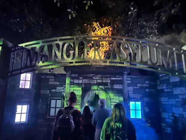 Visitors enter under the Mangler Asylum arch at Knott's Scary Farm 2023. (Brian Rokos/Orange County Register/SCNG)