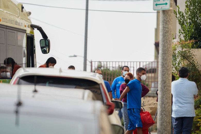 Migrants arrive to St. Anthony's Croatian Catholic Church in Los Angeles on two buses traveling from Texas Sept. 19, 2023.