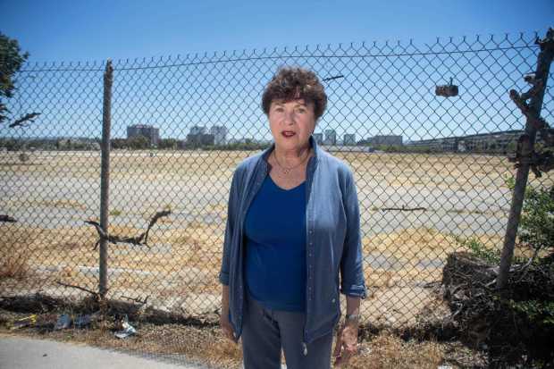 Bonnie Klea, who has been active in helping cancer-stricken workers like herself get compensated for illnesses after working at the Santa Susana Field Laboratory, stands before a former Rocketdyne site in Canoga Park on Tuesday, July 12, 2022 which she wants cleaned of contaminants. Officials with the Los Angeles Water Board say a plume of contaminated groundwater has traveled outside the former Rocketdyne site. (Photo by Sarah Reingewirtz, Los Angeles Daily News/SCNG)