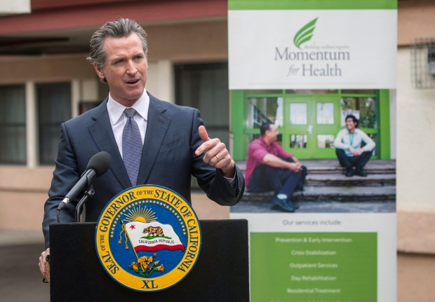 Gov. Gavin Newsom, speaking at a mental health treatment center in San Jose, Calif., announces "Care Court," a program that would let courts order treatment for some homeless people suffering from mental health disorders on Thursday, March 3, 2022. On Wednesday, Sept. 14, 2022, Newsom signed a law creating the program. He said it will take a few years to fully implement. (Karl Mondon/Bay Area News Group via AP, File)