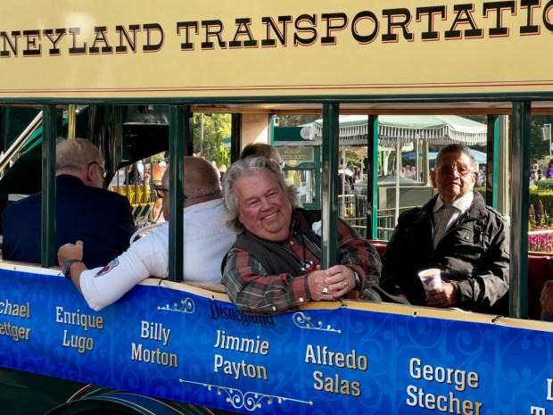 Disneyland cast member Jimmie Payton takes part in the service awards cavalcade along Main Street USA. (Brady MacDonald/Orange County Register)