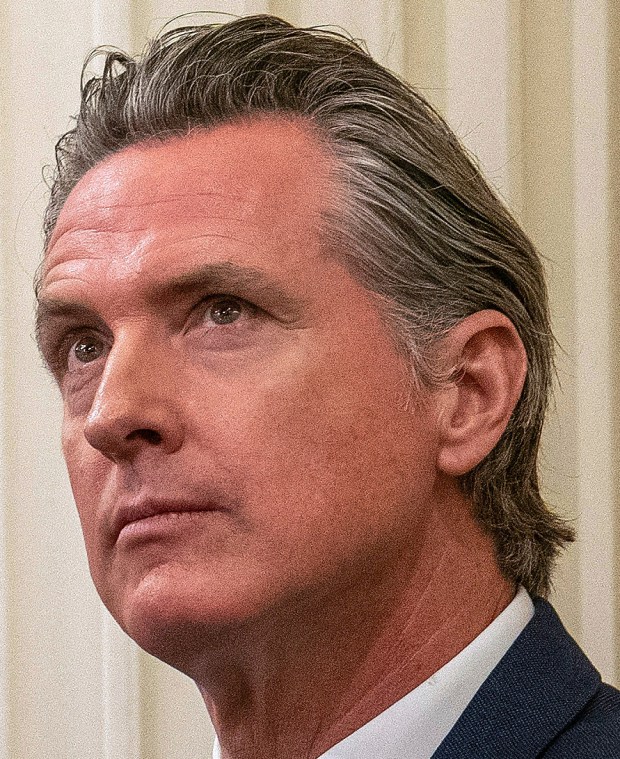 FILE - California Gov. Gavin Newsom sits in the state Assembly at the state Capitol, June 30, 2023, in Sacramento, Calif. In an interview with The Associated Press, Newsom said the prospect of multi-billion dollar budget deficits over the next few years does not change his agenda for his second term in office. Newsom said he will focus on implementing the programs he launched in his first term, including free kindergarten for all 4-year-olds and free health care for low-income residents regardless of their immigration status. (AP Photo/Rich Pedroncelli,File)