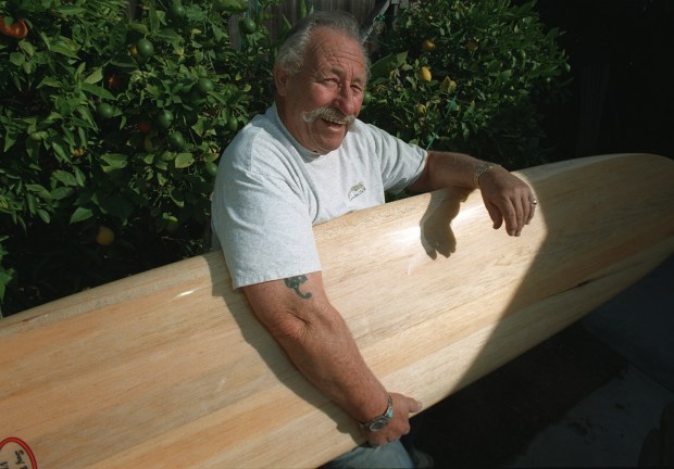 Dale Velzy helped popularize surfing along the California coast and a plaque is being proposed for where he got his start in Manhattan Beach, said to be the first surfboard shop. (AP Photo/The Orange County Register, Chas Metivier)