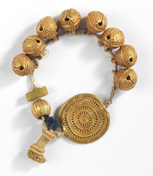 This Strand of Seed or Bug-Shaped Beads, Single Whole Bead, and a Gold Disk is among the items returned to Ghana by the Fowler Museum at UCLA. (Courtesy photo)