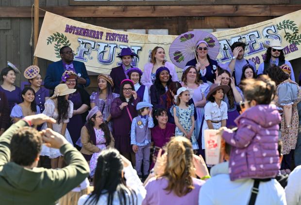 Visitors to Knott's Berry Farm gather on the the Calico Mine Stage to be in a National Boysenberry Day photo at Knott's Berry Farm in Buena Park, CA, on Monday, April 3, 2023. (Photo by Jeff Gritchen, Orange County Register/SCNG)