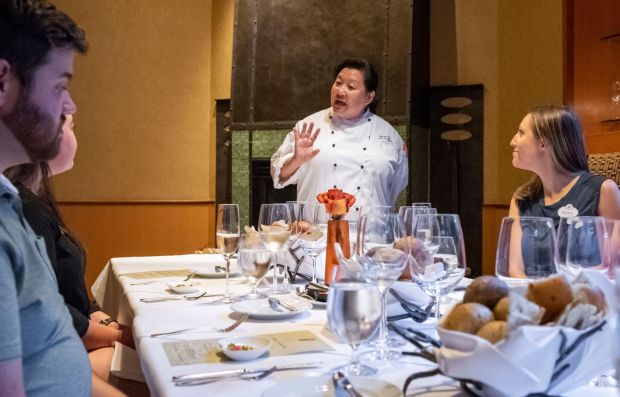 Napa Rose chef Gloria Tae, center, describes one of the plant based dishes being served to a dinner for the media to unveil Disneyland Resorts new plant based menu in Anaheim on Tuesday, September 17, 2019. (Photo by Leonard Ortiz, Orange County Register/SCNG)